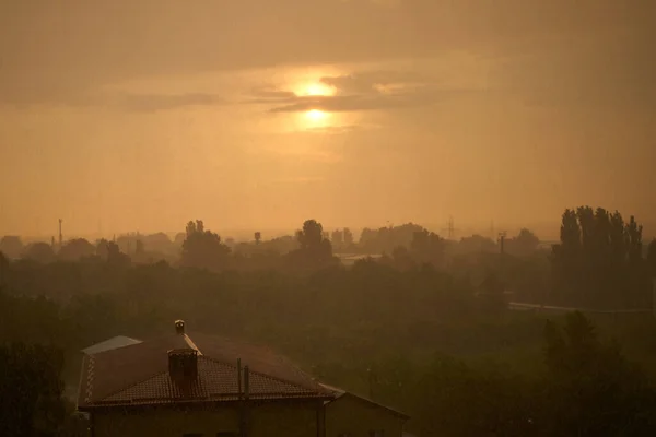 stock image Sunset against dirty rain. Brown color atmosphere.