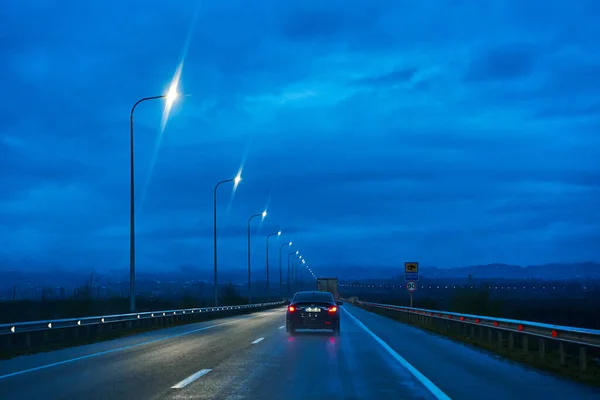 stock image The car is driving on the night freeway. Tbilisi, Georgia - 04.10.2021