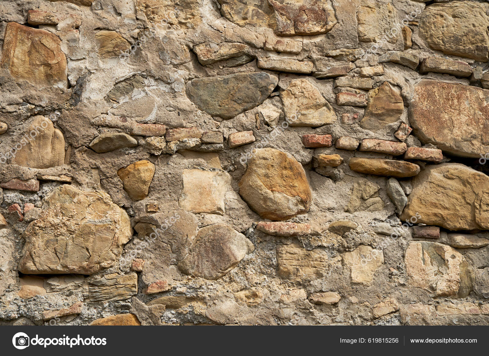 Um muro de pedra com um muro de pedra com textura de pedra.