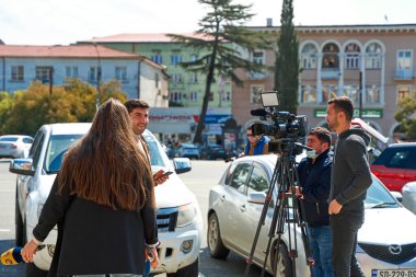 Journalists shoot a personal report and interview passersby. Tbilisi, Georgia - 04.14.2021