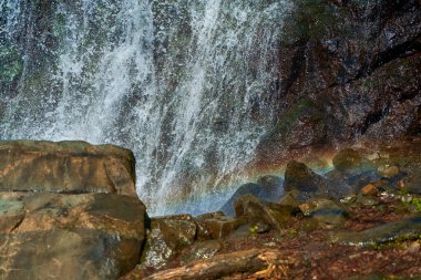 Mountain Falls. The water breaks over the mountain rocks in several tiers.