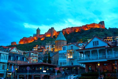 Evening landscape of the architecture of Tbilisi with the illumination of buildings. Tbilisi, Georgia - 03.20.2021