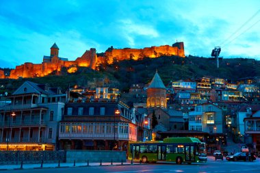 Evening landscape of the architecture of Tbilisi with the illumination of buildings. Tbilisi, Georgia - 03.20.2021
