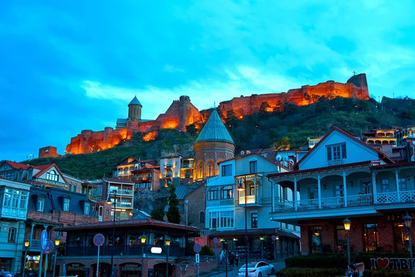 Evening landscape of the architecture of Tbilisi with the illumination of buildings. Tbilisi, Georgia - 03.20.2021