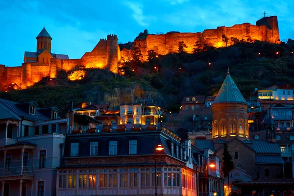 Evening landscape of the architecture of Tbilisi with the illumination of buildings. Tbilisi, Georgia - 03.20.2021