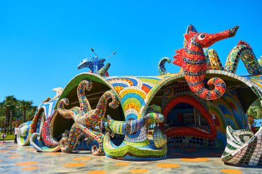 Sculptures of sea animals decorated with colored mosaics on the playground. Batumi, Georgia - 03.28.2021