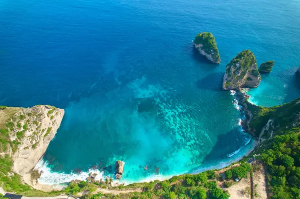 stock image Cinematic aerial landscape shots of the beautiful island Diamond beach of Nusa Penida. Huge cliffs by the shoreline and hidden dream beaches with clear water