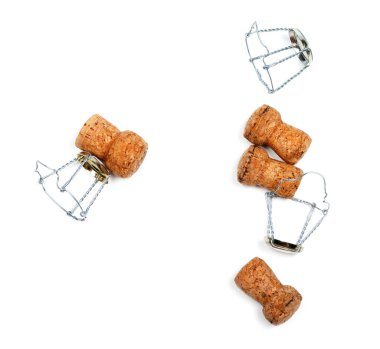 Corks from champagne wine and muselets after party. Isolated on white background. 