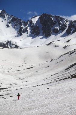 Hiker in high snowy mountains at nice spring day. Turkey, Kachkar Mountains (highest part of Pontic Mountains).