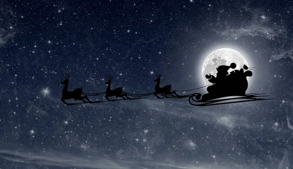 圣诞前夕 圣诞老人乘着雪在夜空中飞翔 — 图库照片