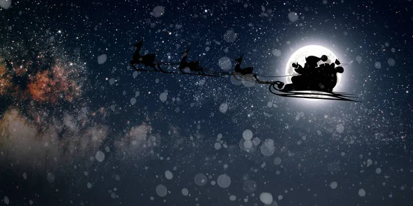 Άγιος Βασίλης Πετάει Παραμονή Χριστουγέννων Στον Νυχτερινό Ουρανό Χιόνι — Φωτογραφία Αρχείου
