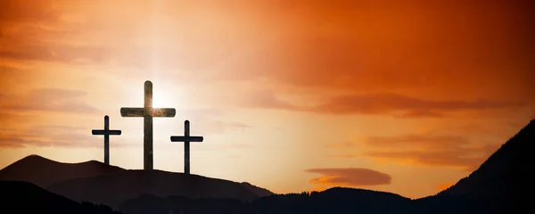 A Easter cross on the dawn background