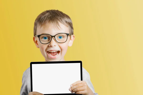 stock image Happy child boy holding a tablet on png background