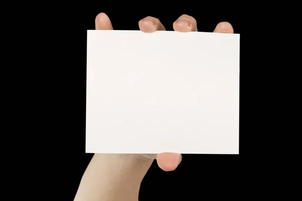 Cartão Branco Uma Mão Nos Backgraunds Pretos — Fotografia de Stock