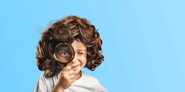 Child see through magnifying glass on the png backgrounds. Big kid eye