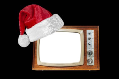 Siyah arka planda Noel Baba şapkasıyla Noel malzemeleri.