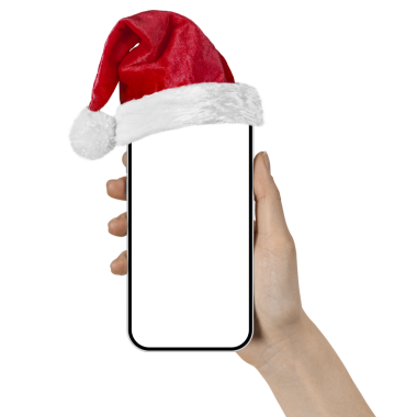 Noel için elinde Noel Baba şapkasıyla bir elinde telefon 