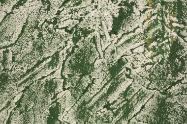 Arka plan olarak beton dokusu. Yeşil ve beyaz sıva duvar, yatay resim.