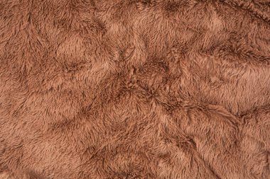 Brown fur background close-up horizontal image.