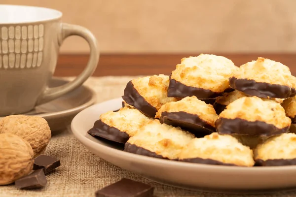 Coconut Cookies Beige Plate Cup Coffee Walnuts Chocolate Burlap Background — Stockfoto