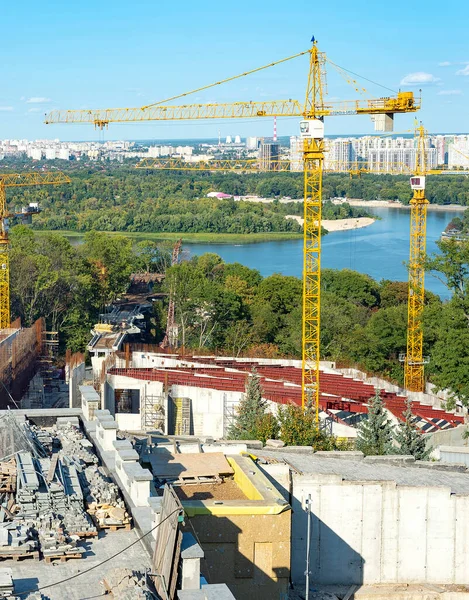 Construction site in Peremga park, left riverbank view, Kiyv summertime cityscape, Ukraine