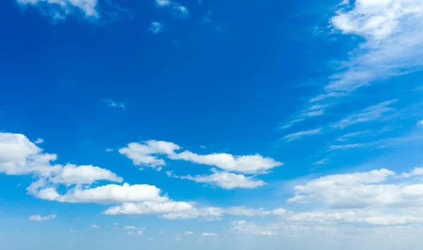 stock image blue sky background with tiny clouds