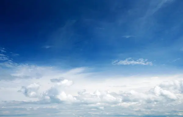 blue sky background with tiny clouds