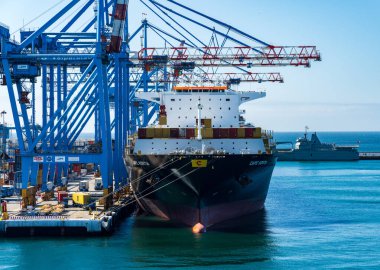 Valparaiso, Chile - 21 January 2023: Container being lowered onto Cape Kortia ship in Valparaiso harbor