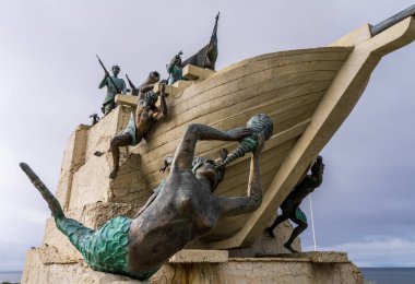 Punta Arenas, Chile - 27 January 2023: Monument to Magellan and his ship with mermaids on water front