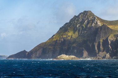 Rocky cliffs form Cape Horn on Hornos Island in Chile