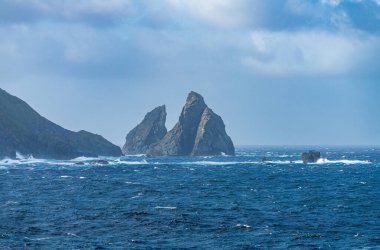 Jagged rocky outcroppings off Hornos Island near Cape Horn in Chile
