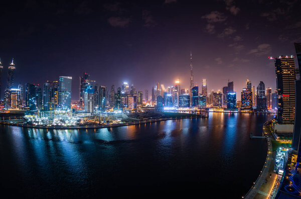 Dubai, UAE - April 1, 2023: Night view of skyline of downtown district from apartment in Business Bay