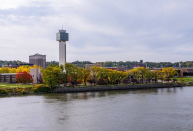 Panorama of downtown Moline in Illinois seen from the I-74 interstate bridge along Mississippi River clipart