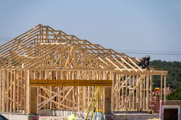 stock image Georgetown, TX - September 10, 2024: Single family home with slab foundations, dimensional lumber frames roof trusses creating the structure of house