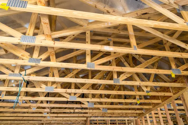 stock image Interior of single family home with slab foundations and dimensional lumber frames and roof trusses creating the structure of the house