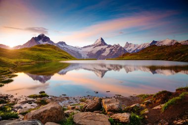 Great view of the snow rocky massif. Popular tourist attraction. Dramatic and picturesque scene. Location place Bachalpsee in Swiss alps, Grindelwald valley, Bernese Oberland, Europe. Beauty world.