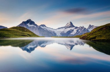 Great view of the snow rocky massif. Popular tourist attraction. Dramatic and picturesque scene. Location place Bachalpsee in Swiss alps, Grindelwald valley, Bernese Oberland, Europe. Beauty world.