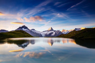 Great view of the snow rocky massif. Popular tourist attraction. Dramatic and picturesque scene. Location place Bachalpsee in Swiss alps, Grindelwald valley, Bernese Oberland, Europe. Beauty world.
