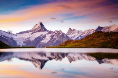 Great view of the snow rocky massif. Popular tourist attraction. Dramatic and picturesque scene. Location place Bachalpsee in Swiss alps, Grindelwald valley, Bernese Oberland, Europe. Beauty world.