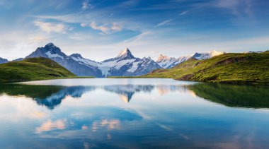 Great view of the snow rocky massif. Popular tourist attraction. Dramatic and picturesque scene. Location place Bachalpsee in Swiss alps, Grindelwald valley, Bernese Oberland, Europe. Beauty world.