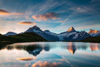 Great view of the snow rocky massif. Popular tourist attraction. Dramatic and picturesque scene. Location place Bachalpsee in Swiss alps, Grindelwald valley, Bernese Oberland, Europe. Beauty world.