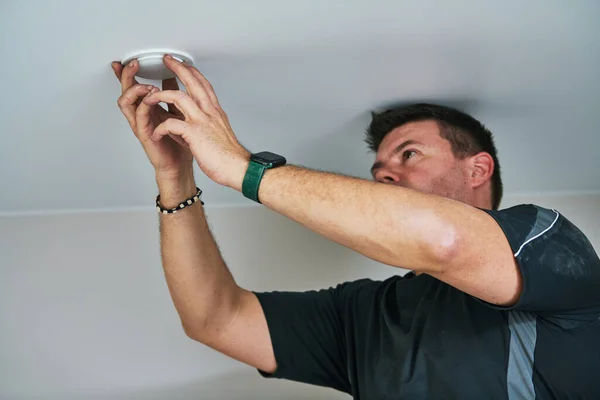 Worker Electrician Installing Lamp Stretch Ceiling Indoors — Stock Photo, Image