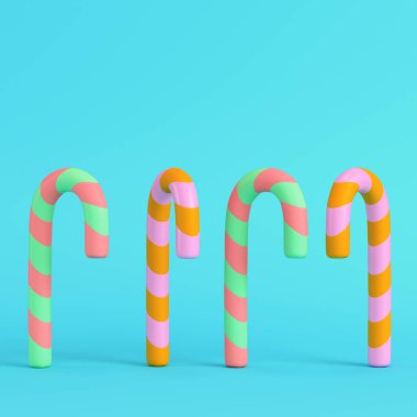 Pastel renklerde parlak mavi arka planda dört renkli baston şeker. Minimalizm kavramı. 3d hazırlayıcı