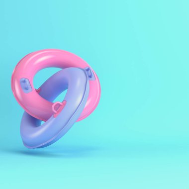 Pastel renklerde parlak mavi arka planda iki çapraz şişme cankurtaran halkası. Minimalizm kavramı. 3d hazırlayıcı