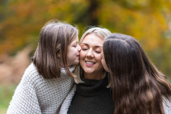 Two Happy Girls Daughters Kissing Mother Cheeks Close View Two — Stock Photo, Image
