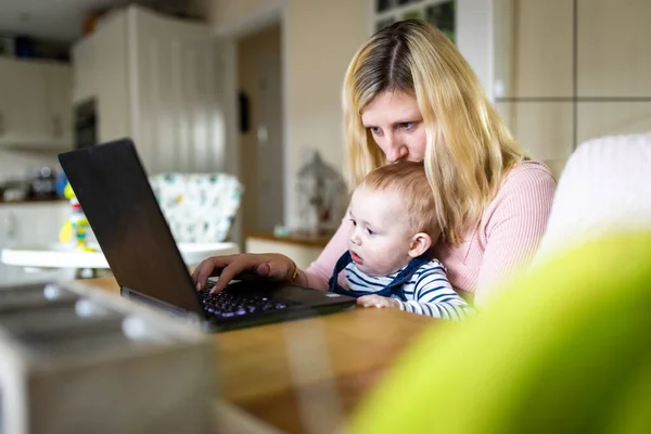Authentic Home Shot Young Woman Baby Boy Looking Computer Home — Stock fotografie