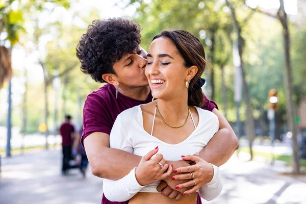 Happy Couple Hugging Smiling Man Embracing His Girlfriend Giving Kiss — Stock Photo, Image
