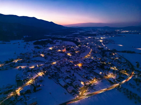 Aerial View Snowy Mountain Town Nighttime Stockfoto