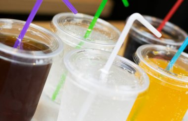 Drinks in plastic glasses with straws