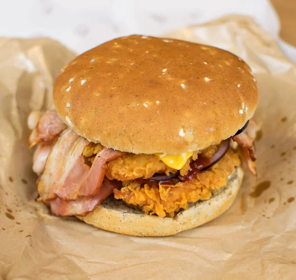 Burger Breaded Chicken Bacon Paper Fatty Unhealthy Food — Stock Photo, Image